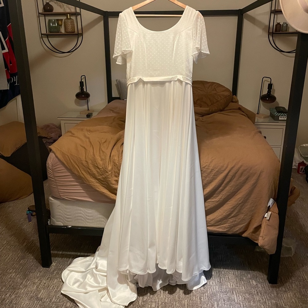 Never worn custom made wedding dress.
